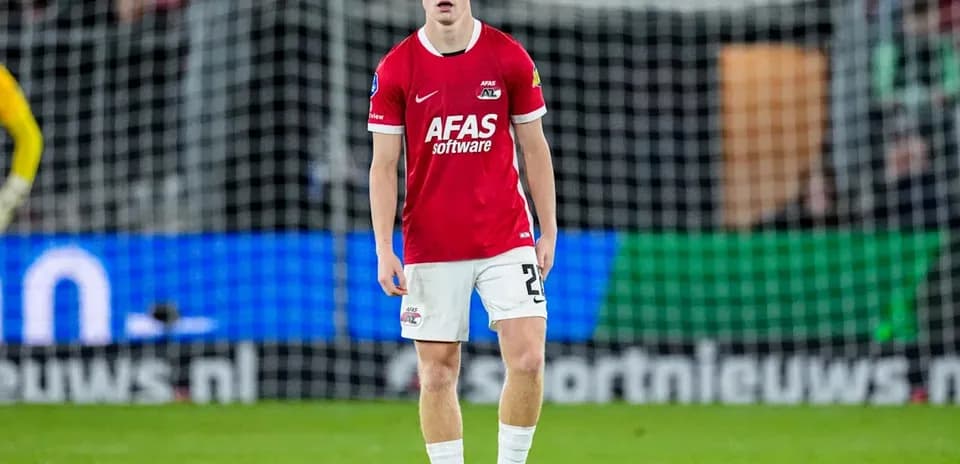 Player standing on the pitch during match