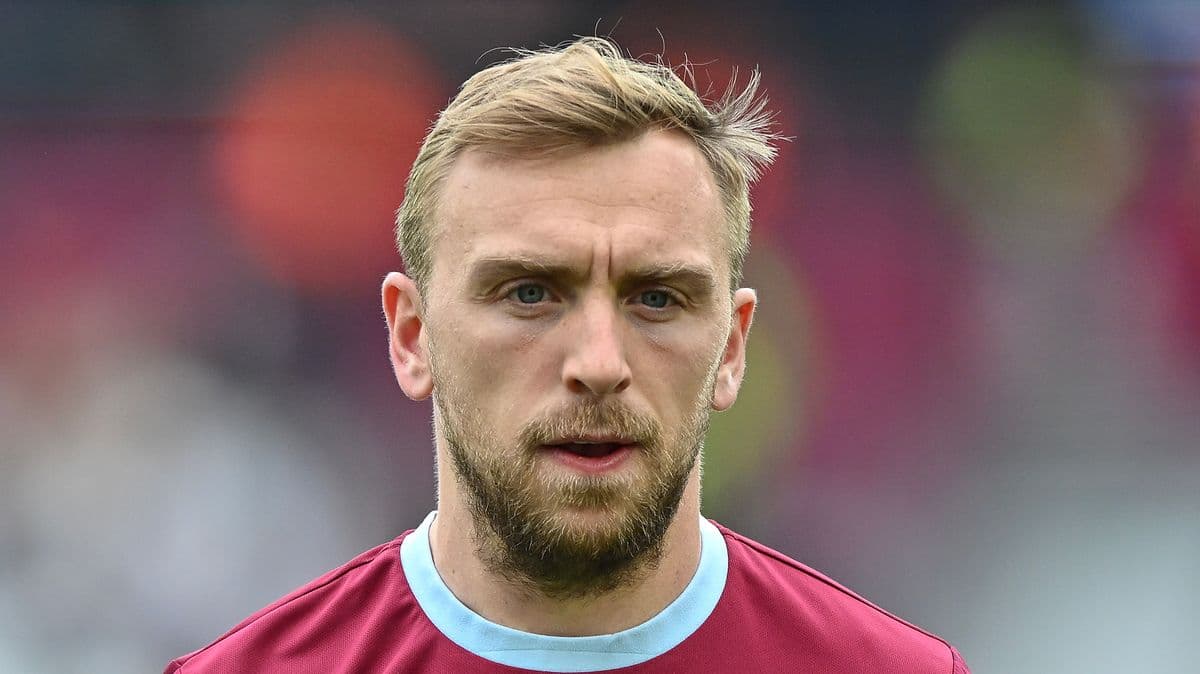 Player with short blonde hair in team jersey