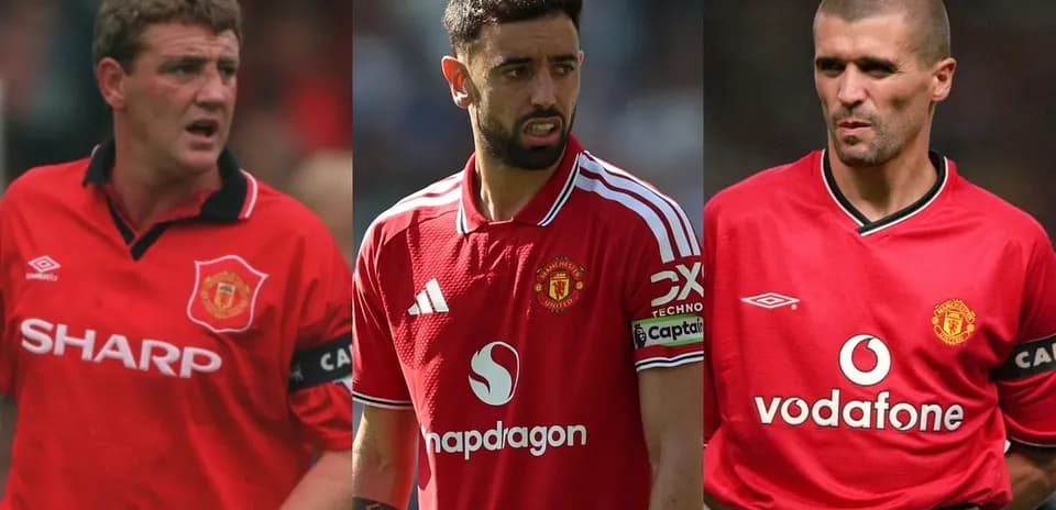 Three Manchester United players in red jerseys