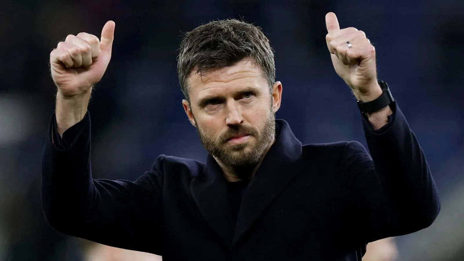 Coach giving thumbs up after match conclusion