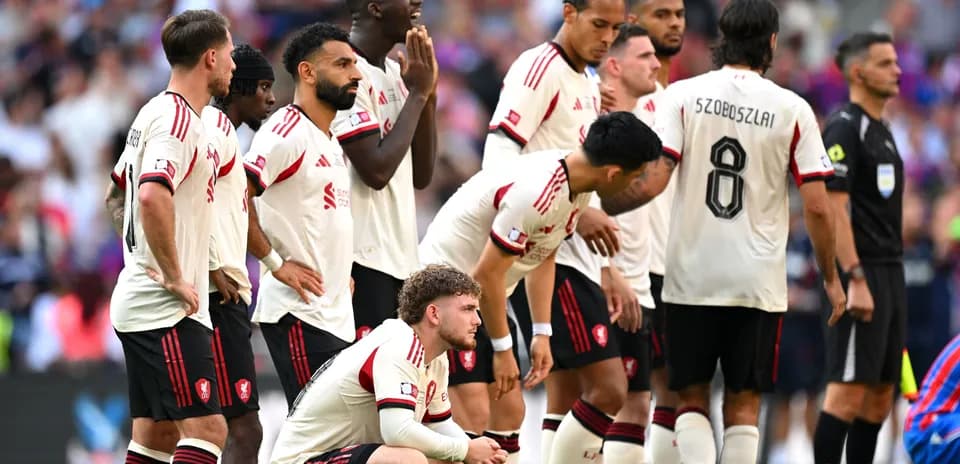 Players in white jerseys waiting during a match