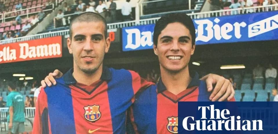 Two FC Barcelona players posing together in stadium
