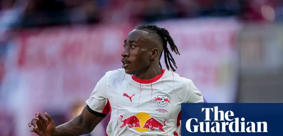 Player running on the pitch wearing RB Leipzig kit