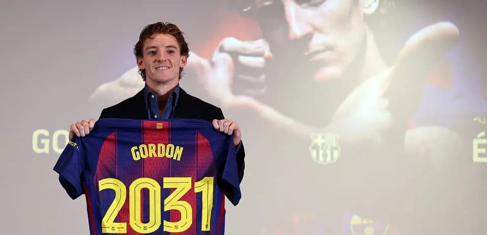 Player holding Barcelona jersey with 'Gordon' and '2031'