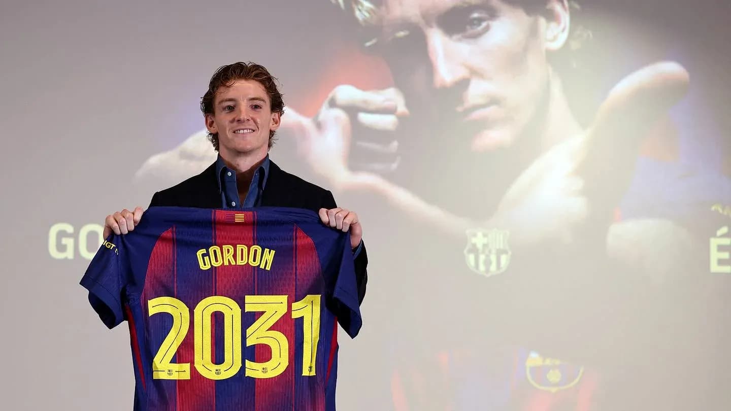 Player holding Barcelona jersey with 'Gordon' and '2031'