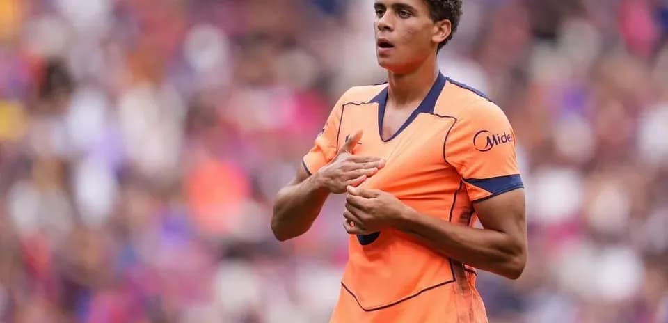 Player in orange kit during match action