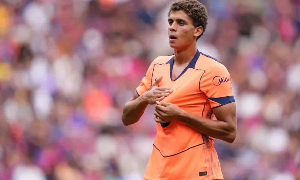 Player in orange kit during match action