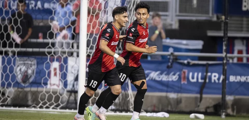 Players celebrating a goal during USL Championship match