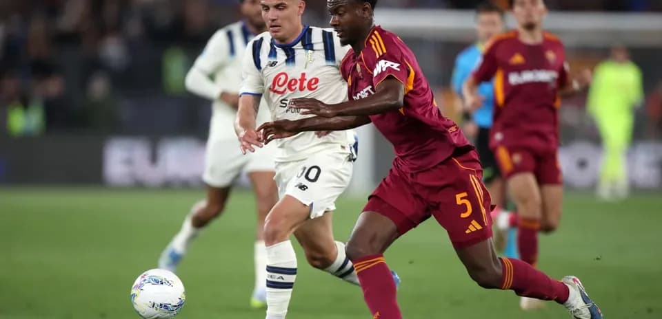 AS Roma player battling for the ball