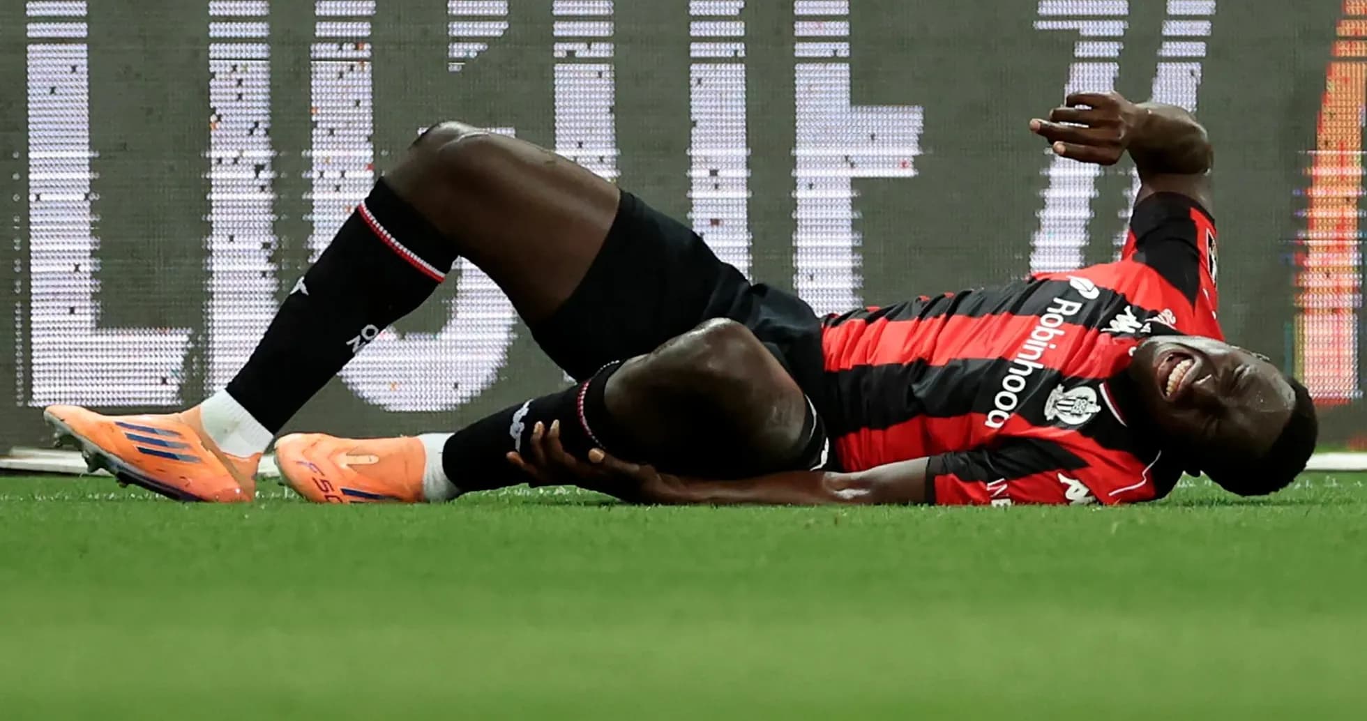 Player lying on the ground in pain during match