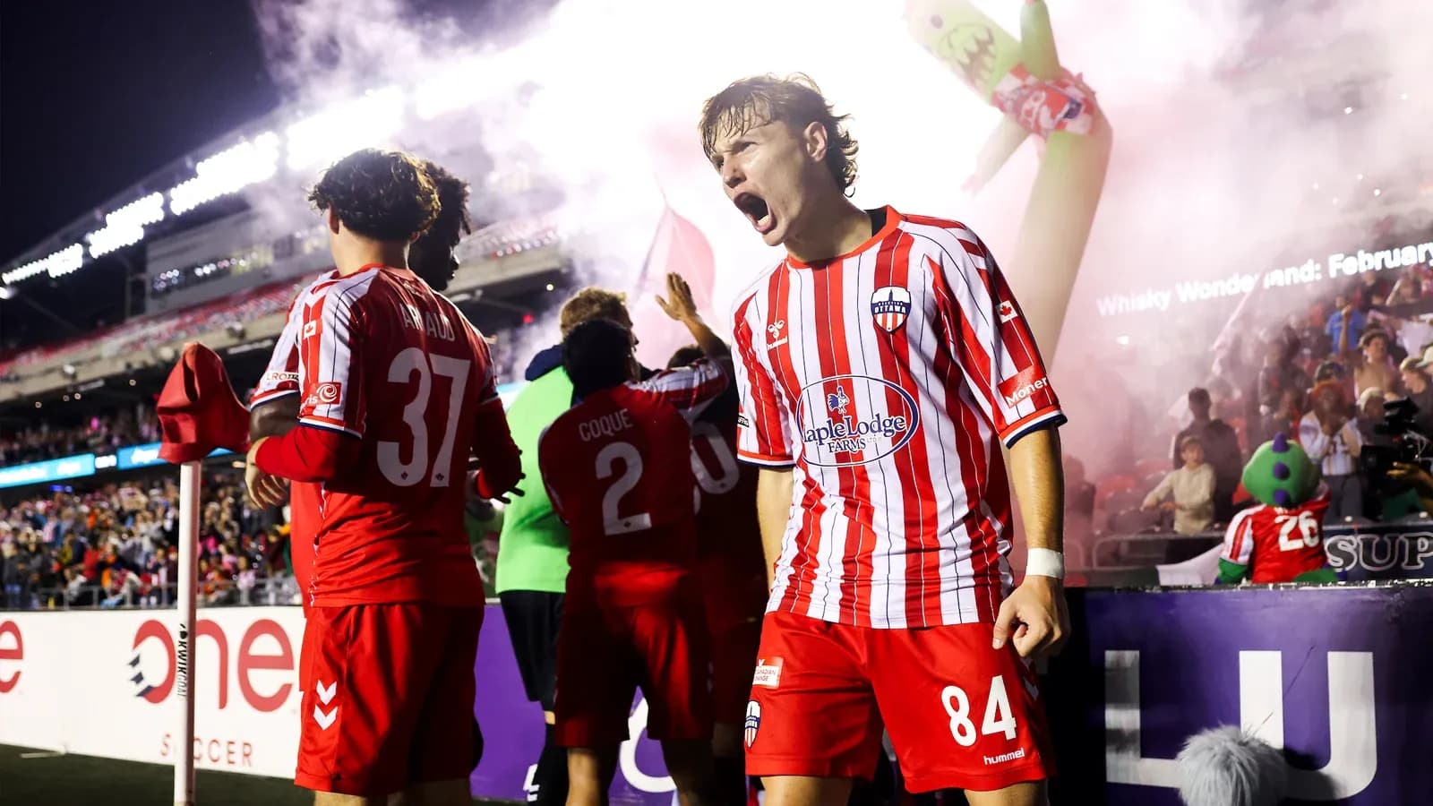 Players celebrating after a goal during match