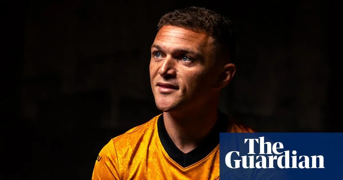 Player in orange jersey during portrait session