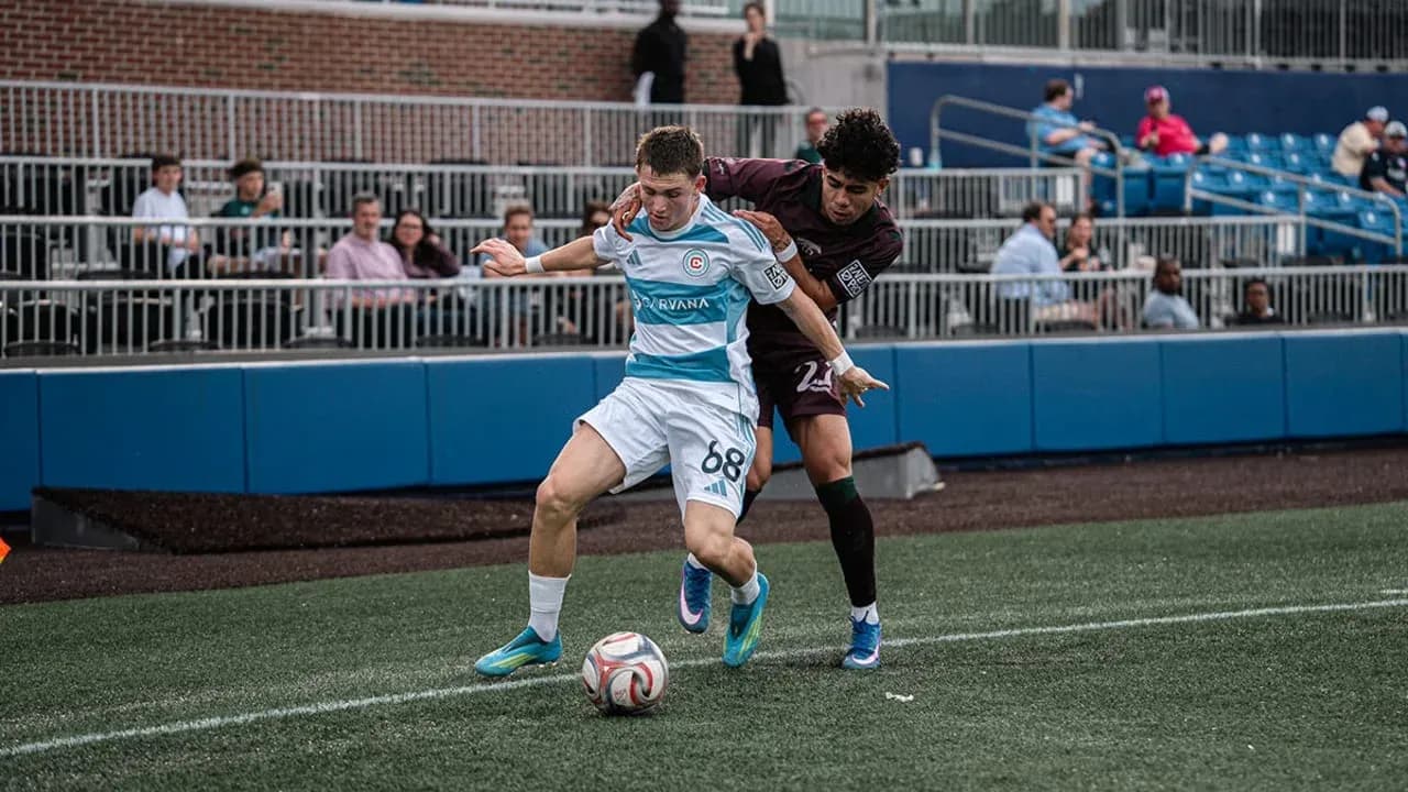 Player competing for the ball during MLS Next Pro match