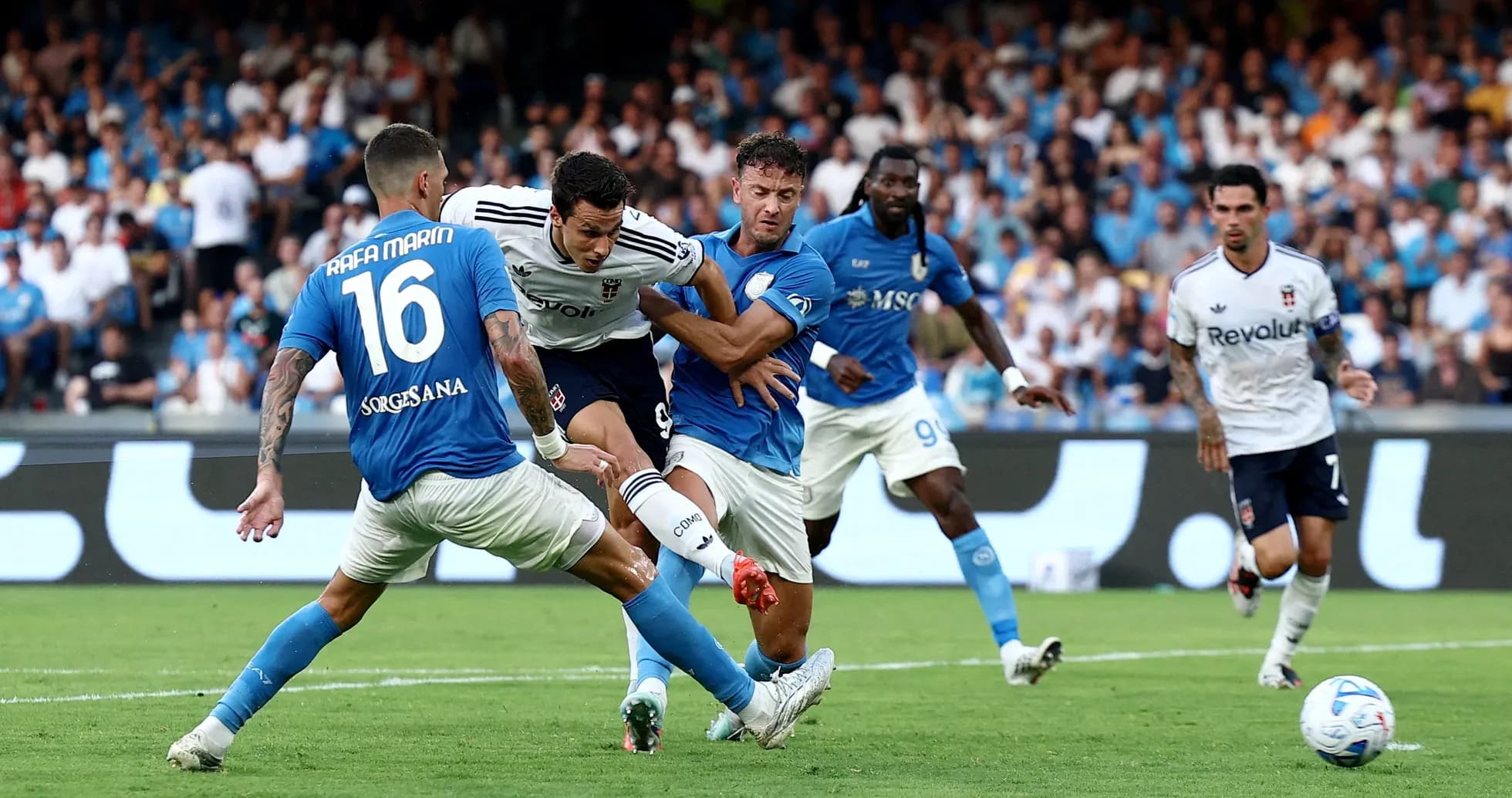 Players competing for the ball during Napoli match