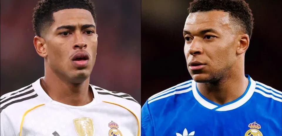 Two players in Real Madrid jerseys looking serious
