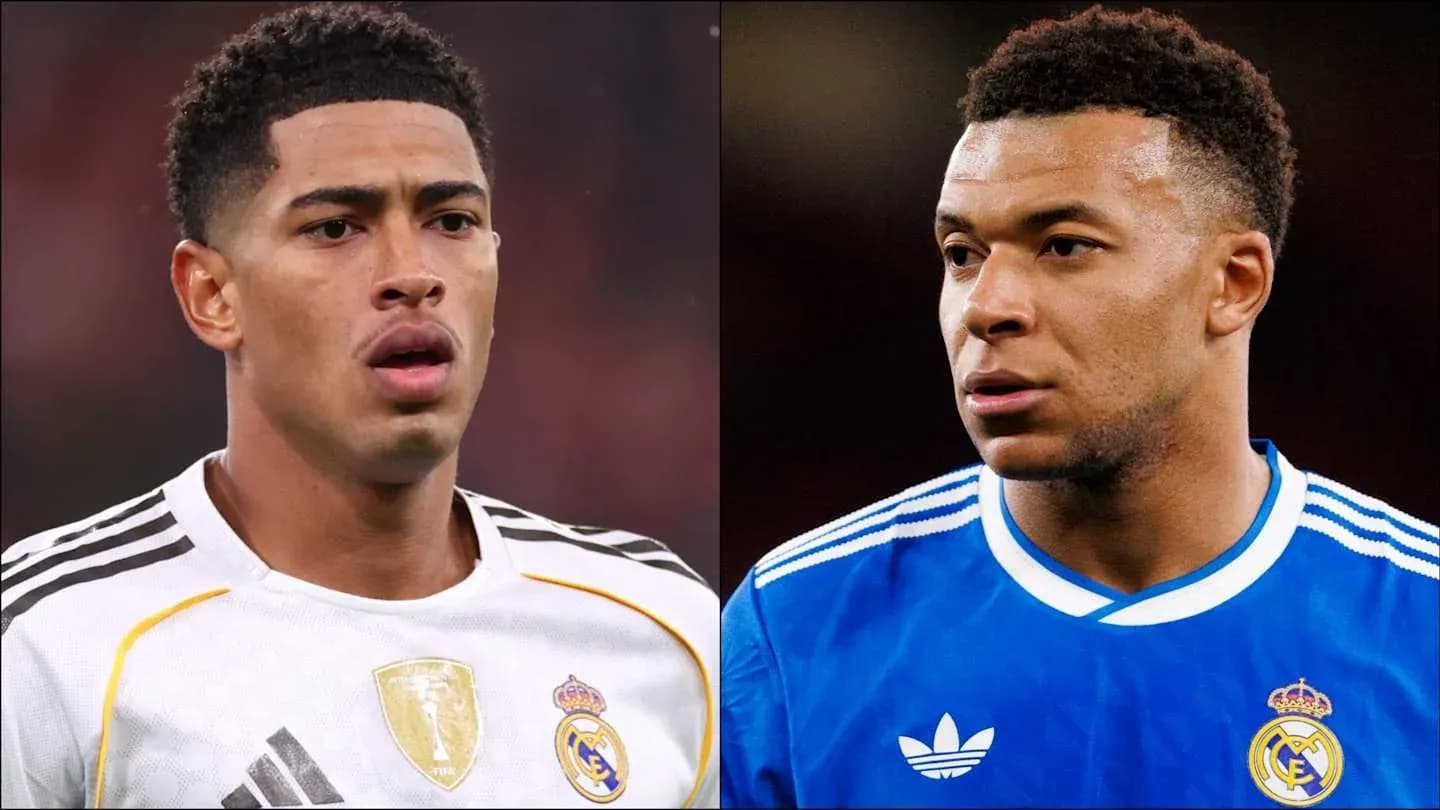 Two players in Real Madrid jerseys looking serious