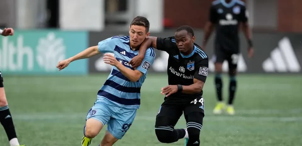 Players competing for the ball in MLS Next Pro