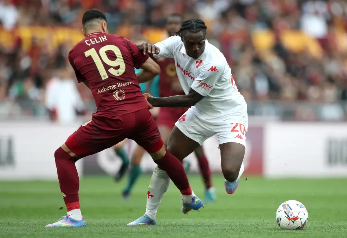 Player challenging for the ball during AS Roma match