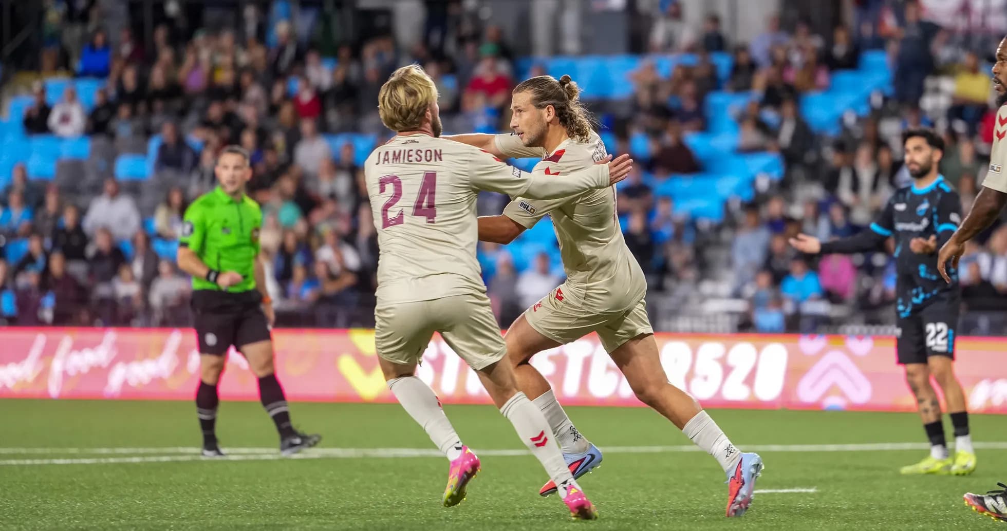Players celebrating during Colorado Springs match