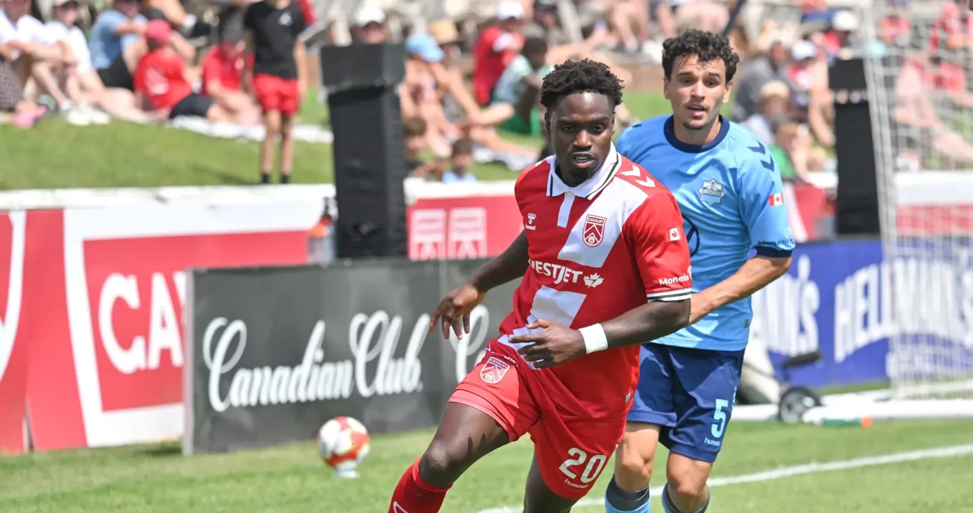 Cavalry FC player dribbling during match