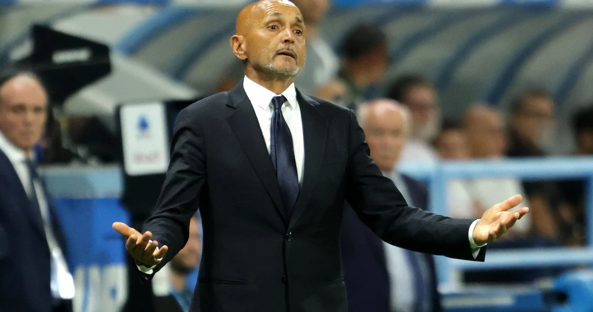 Coach gesturing during a match on the sidelines