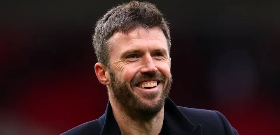Man smiling in sports venue with blurred background