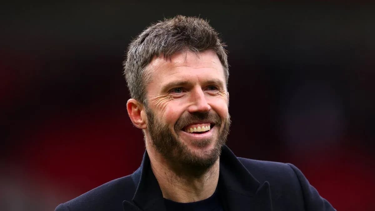 Man smiling in sports venue with blurred background