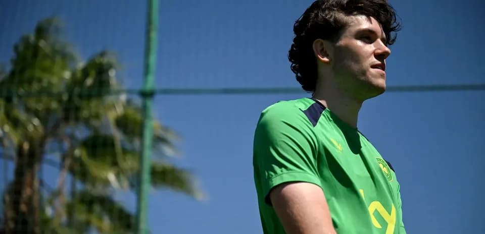 Player in green jersey at training session