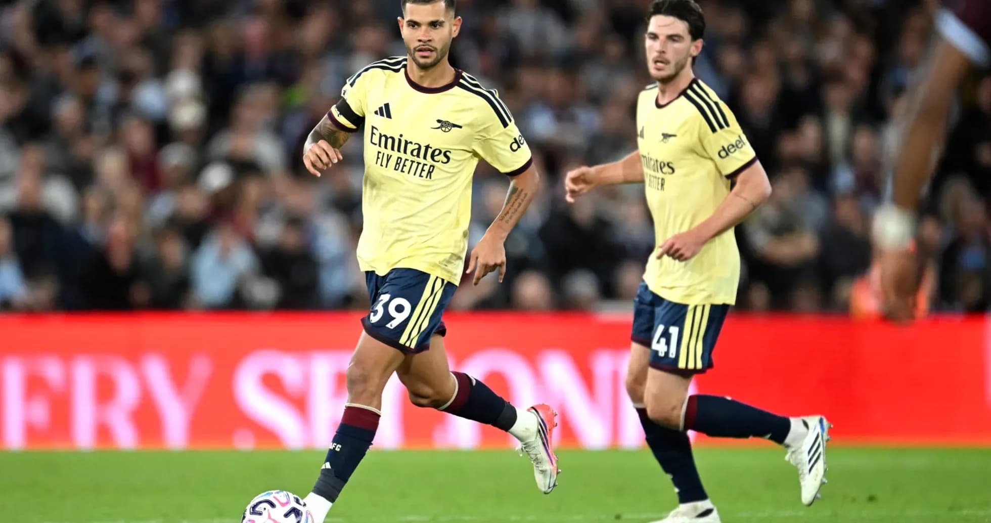 Two Arsenal players on the field during match