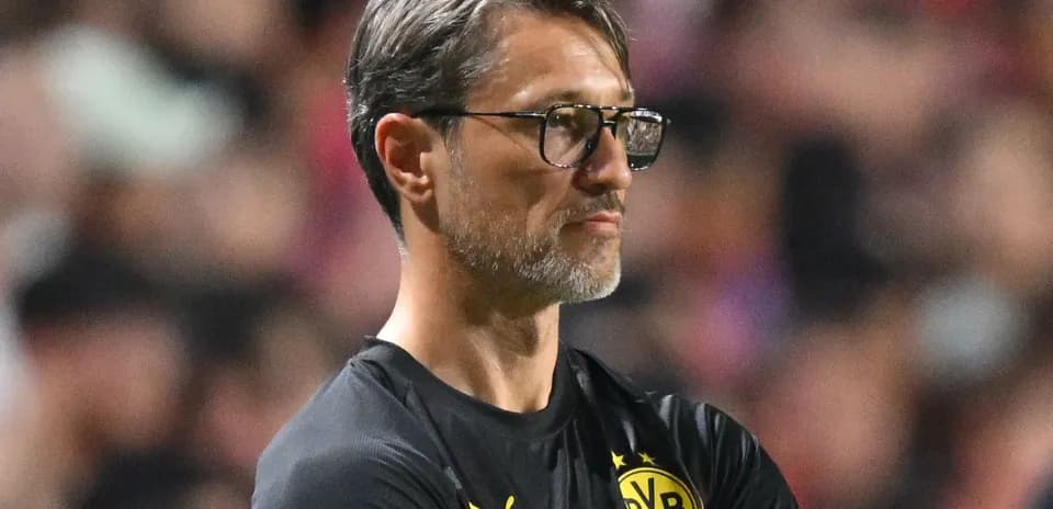 Coach observing the match from the sidelines