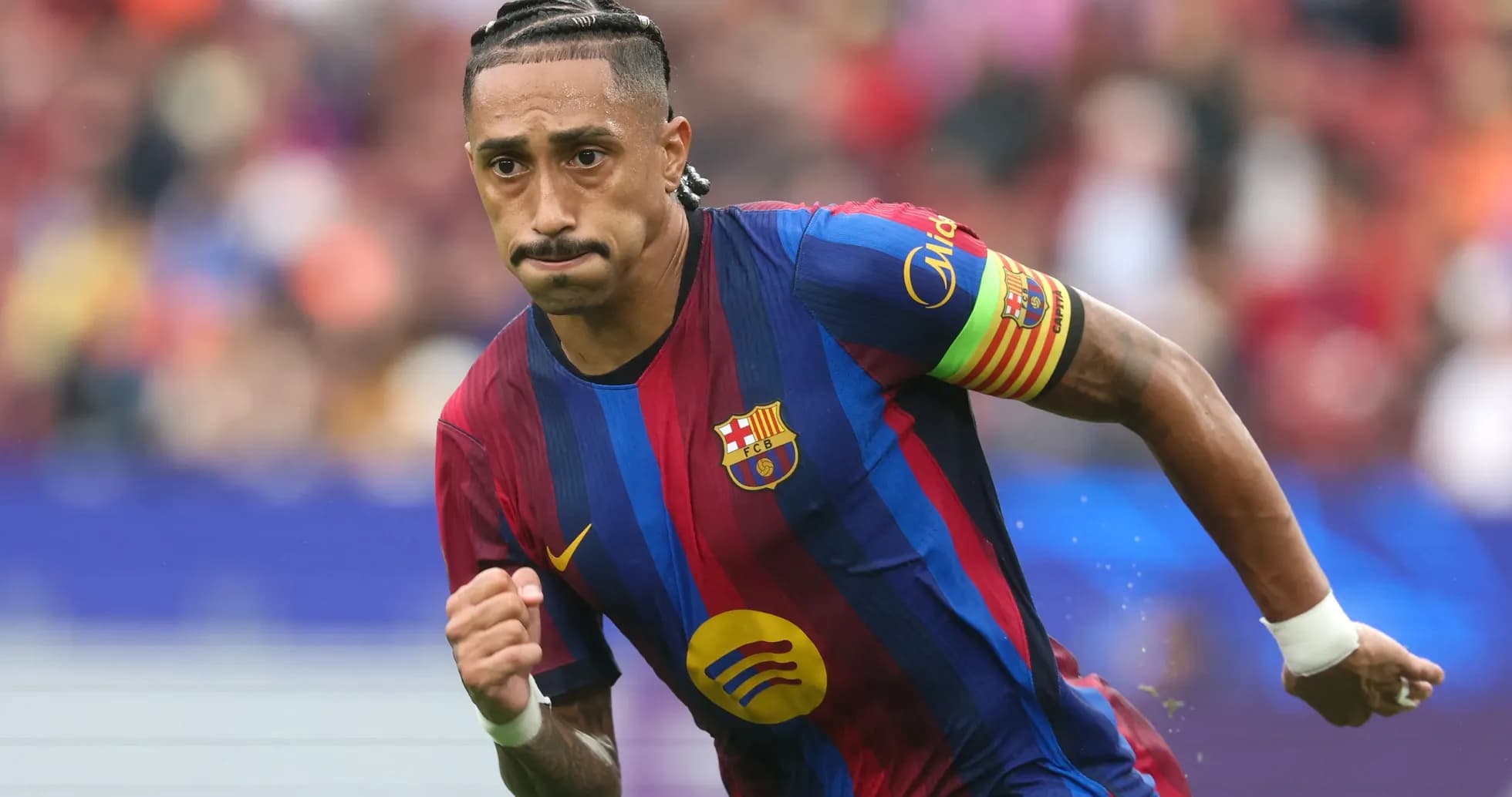 Player in Barcelona kit running on the field
