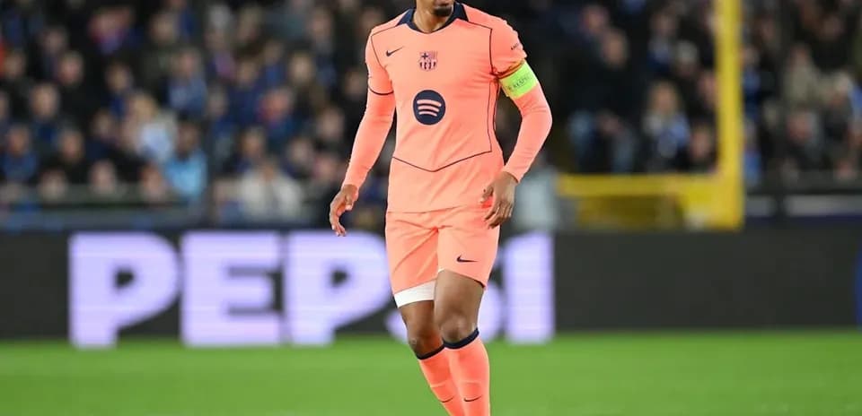Player in pink jersey dribbling ball on field