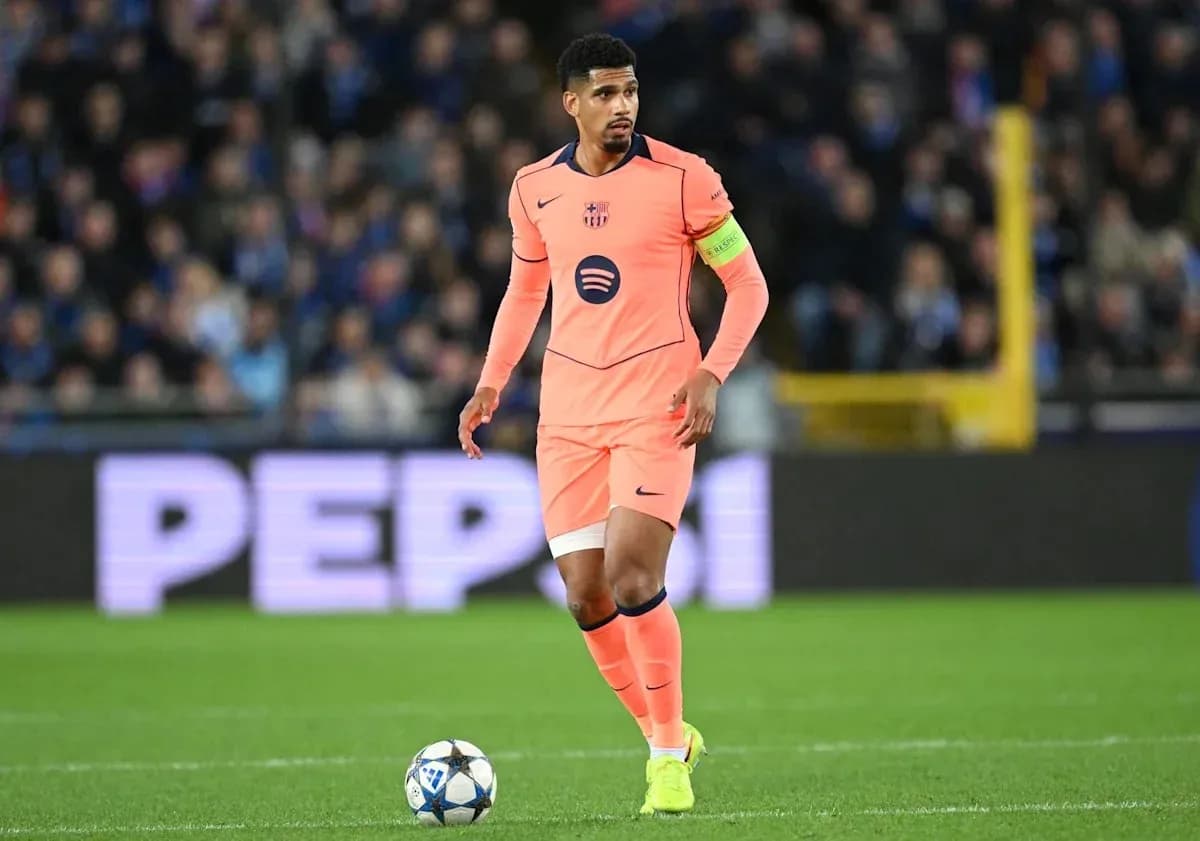 Player in pink jersey dribbling ball on field