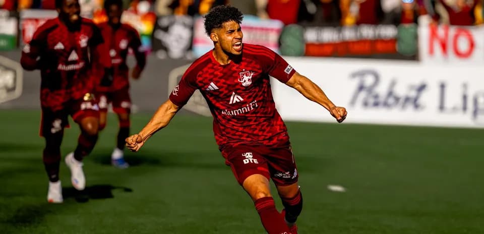 Player celebrating goal during JAX vs Detroit City match