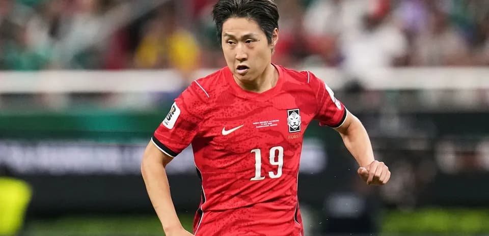 Player wearing red jersey running on the field