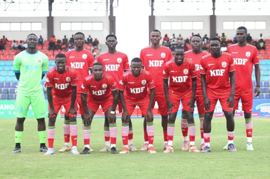 KDF football team posing for team photo on field