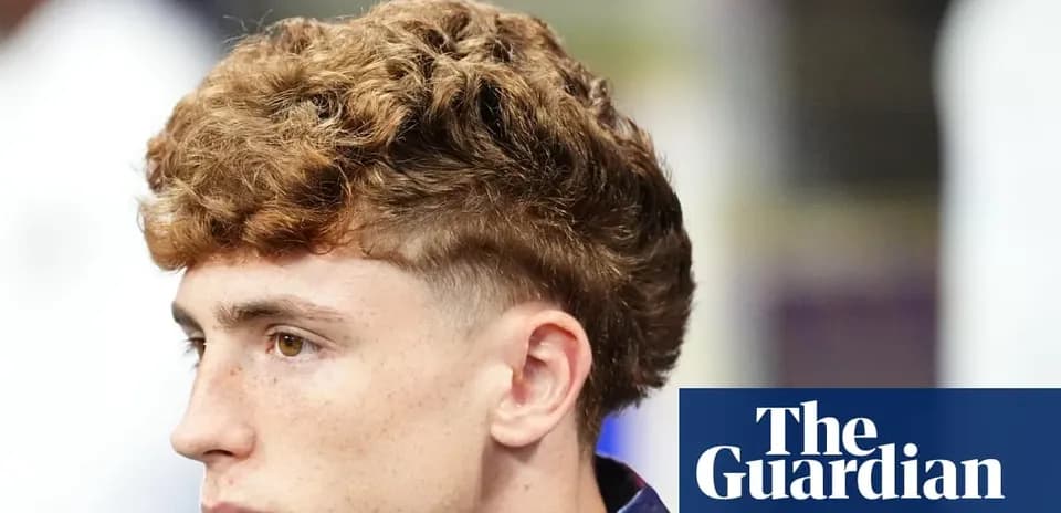 Close-up of a young man with curly hair