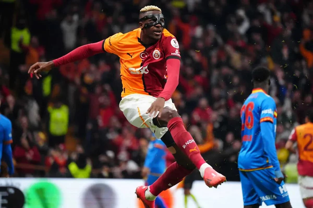 Player celebrating a goal wearing a mask