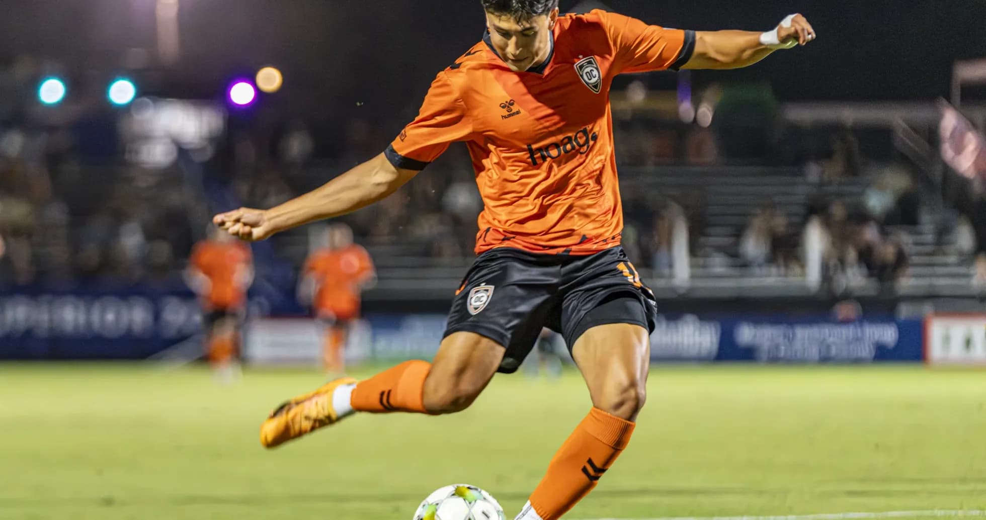 Player kicking ball during New Mexico United match