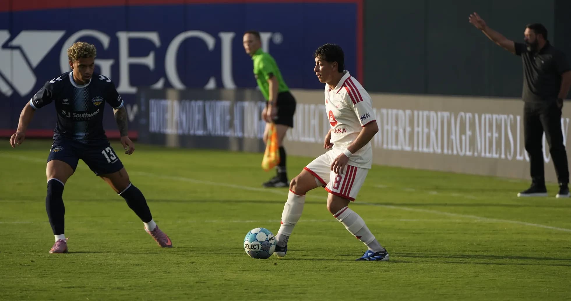 El Paso Locomotive player dribbling against Phoenix Rising