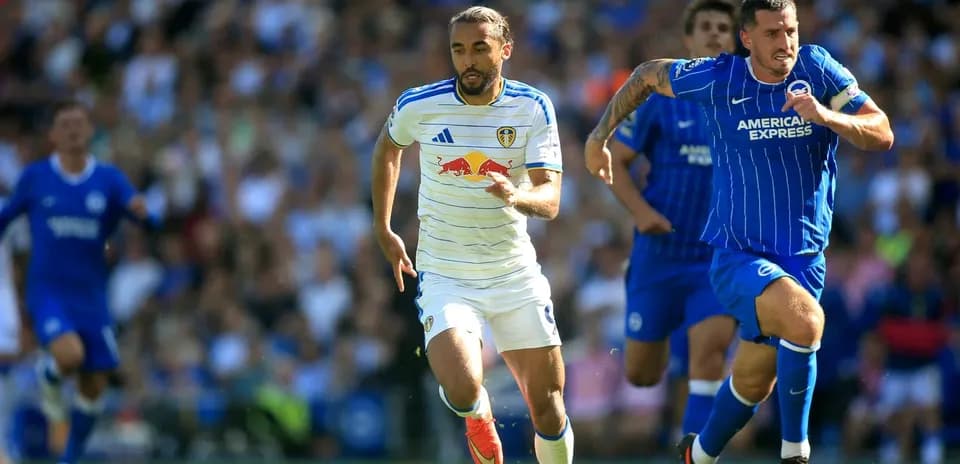 Leeds player sprinting with Brighton player pursuing