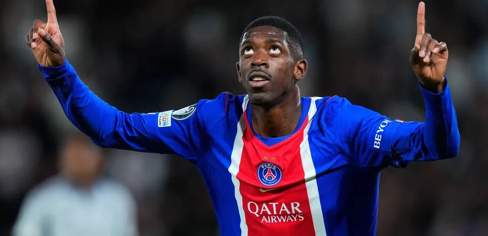 Player celebrating goal in PSG jersey during match