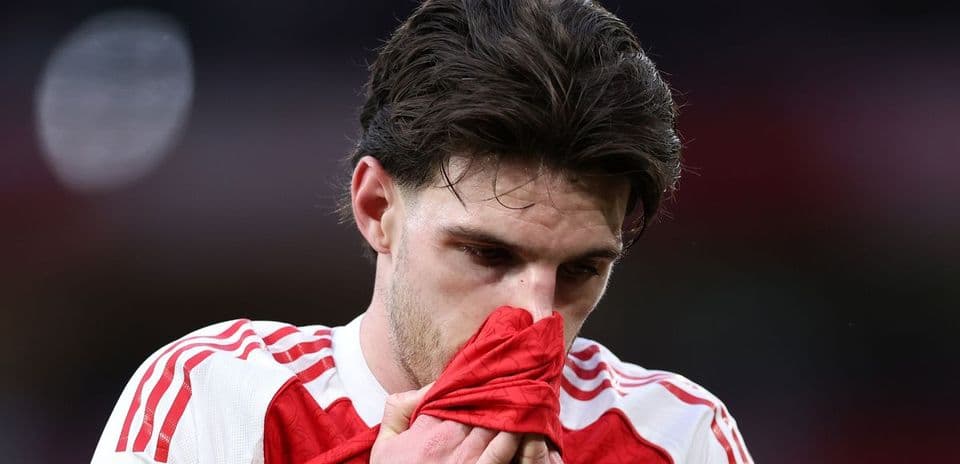 Player holding jersey to face during match