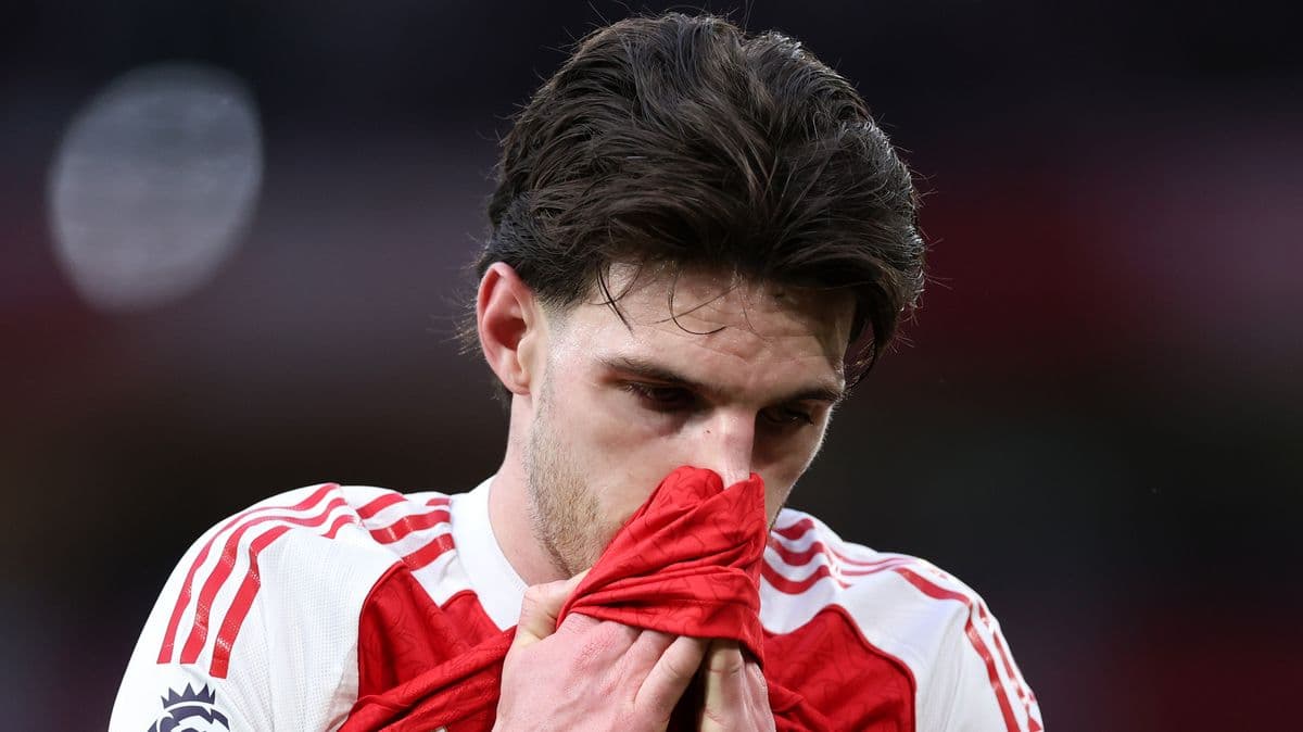 Player holding jersey to face during match