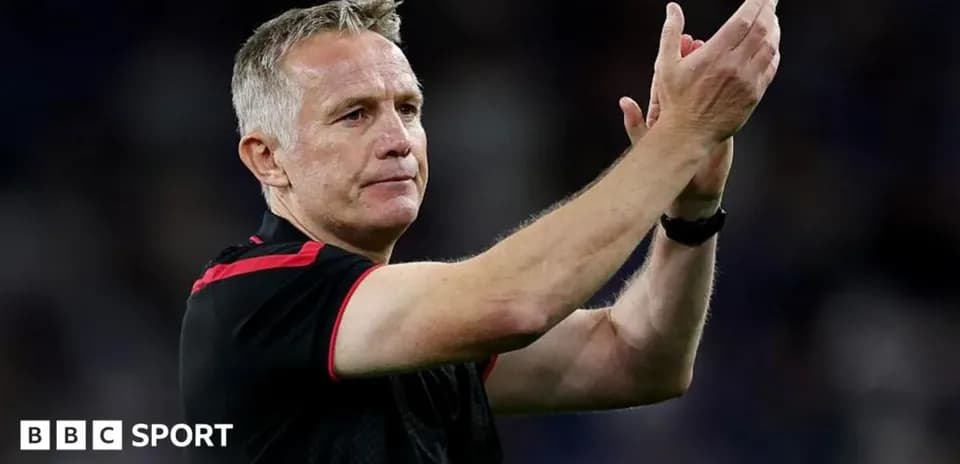 Coach applauding after match on the field