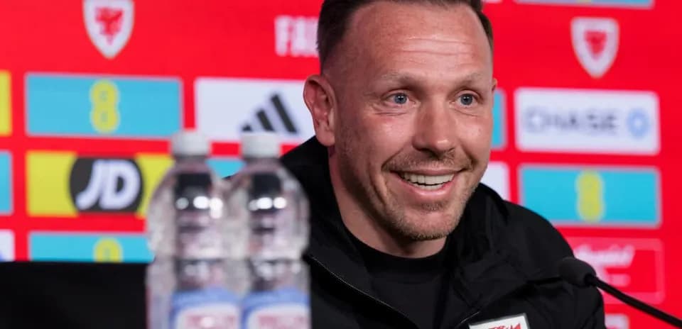 Manager at press conference with water bottles