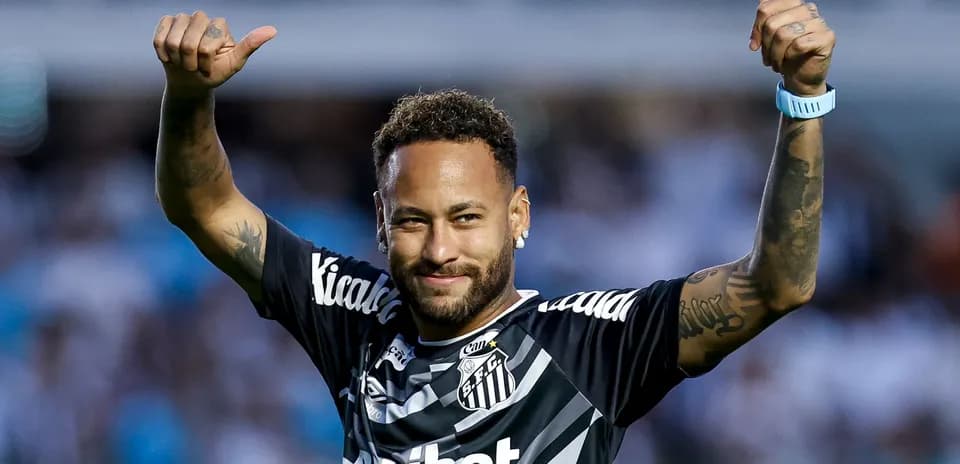 Player celebrating with thumbs up in team jersey
