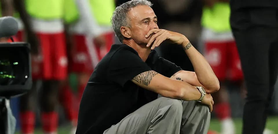Coach sitting on the sidelines during a match