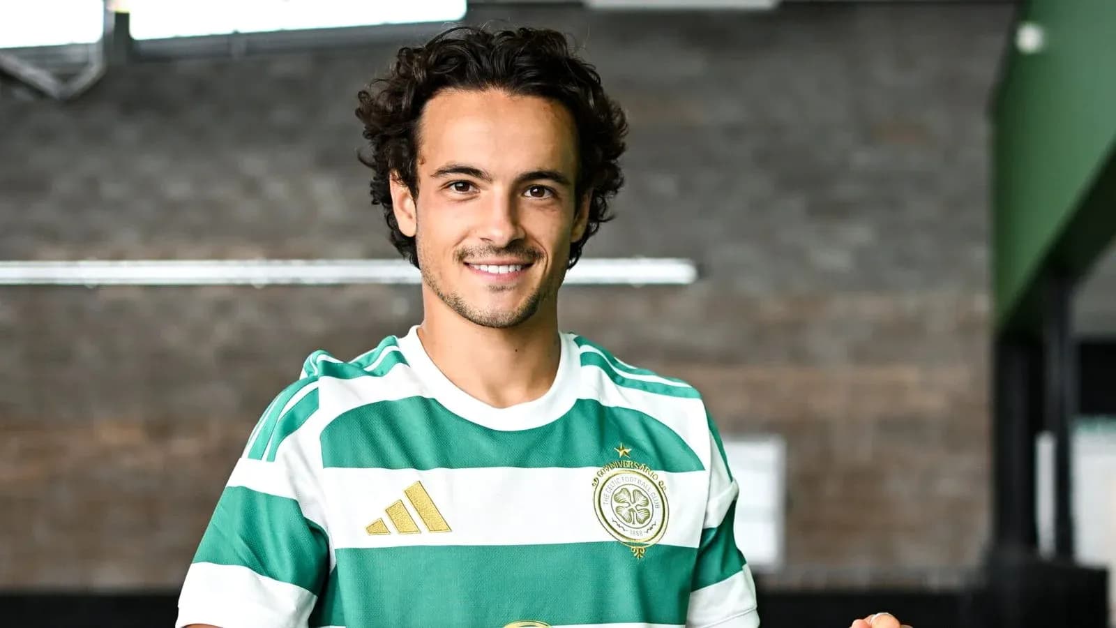 Player wearing Celtic FC jersey in training facility
