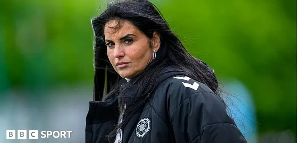 Coach observing training session with serious expression